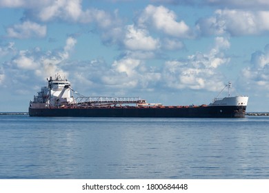 CLEVELAND, OH - August 18, 2020:  Built in 1979 and measuring over 634 feet in length, the Great Lakes bulk carrier American Courage visits Cleveland, Ohio loaded with a cargo of aggregate material