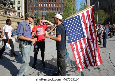 Cleveland, OH July 19, 2016: Republican National Convention - A Man With A Rifle Argues With A Democratic Support Over Their Beliefs 