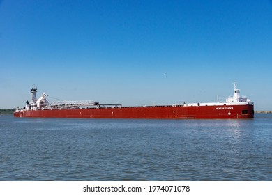 CLEVELAND, OH - May 14, 2021: The tug Dirk S. Vanenkevort and barge Michigan Trader make an infrequent visit to Cleveland while delivering iron ore to the Cleveland Bulk Terminal