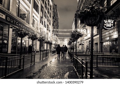 Cleveland Ohio - December 9, 2019: East 4th offers world-class dining and entertainment in the heart of Downtown Cleveland.  Photographed on a rainy winter night.