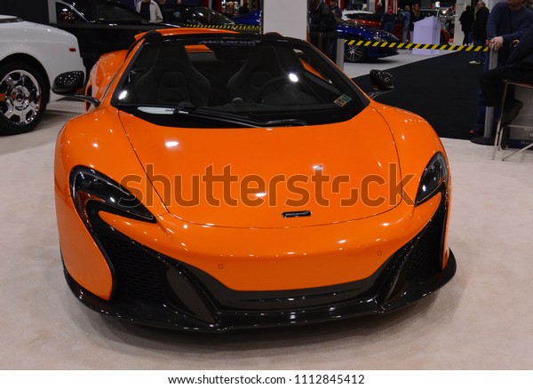 Cleveland, Ohio, United States -
March 25, 2015: Modern neon orange and black sports car showcase

