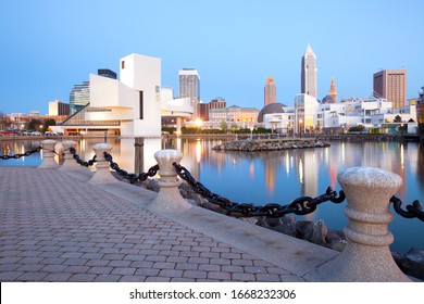 Cleveland, Ohio, United States - The Modern Building Of The Rock And Roll Hall Of Fame Museum. And Downtown Skyline.