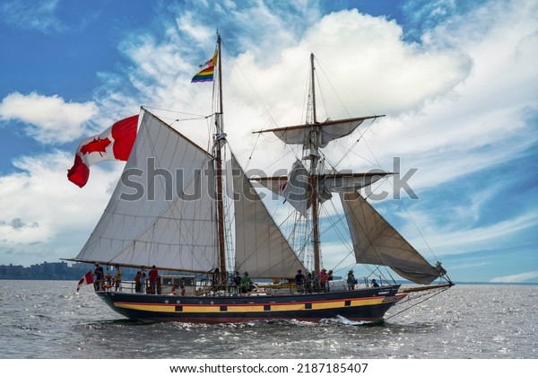 CLEVELAND, OHIO, USA - JULY 7, 2022: The sailing\
ship St. Lawrence II sails into Cleveland on Lake Erie during the\
annual Tall Ships Festival. This year seven tall ships entered the\
harbor and docked.