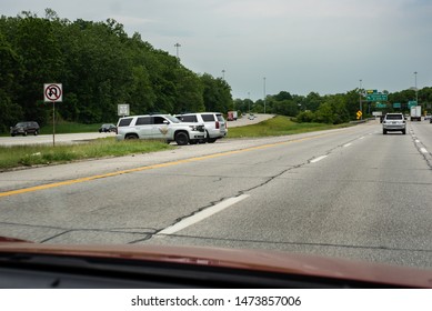 Cleveland, Ohio - USA/ June 04 2019:  Two Ohio State Highway Patrol Vehicles Parked In Between The Highways In The Restricted Vehicle Zone.