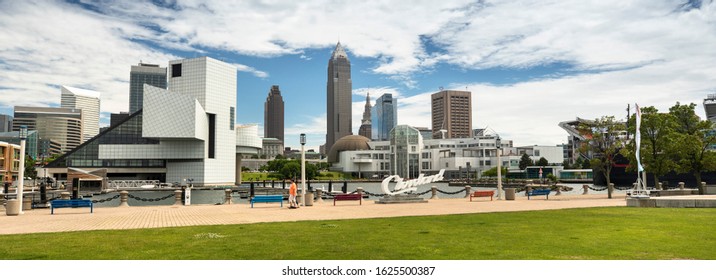 Cleveland, Ohio, USA - June 19, 2018:  People Gather By The Famous Cleveland Sign Landmark Script Overlooking The Skyline In Downtown Ohio USA