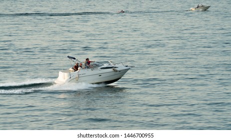 Cleveland, Ohio/USA - July 4, 2019: Small Fishing Boat Racing Across Lake Erie During The Fourth Of July Festivities Near Downtown Cleveland.