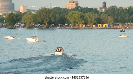 Cleveland, Ohio/USA - July 4, 2019: Fun On The Lake At The Fourth Of July Holiday Weekend Festivity Special With Fishing Vessels Cruising Along Edgewater Beach Near Downtown Cleveland.