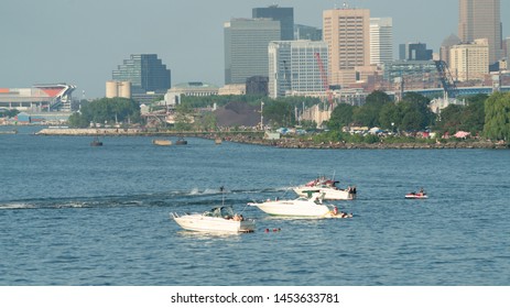 Cleveland, Ohio/USA - July 4, 2019: Group Of Fishing Boats On Lake Erie With Urban Structures In The Background.