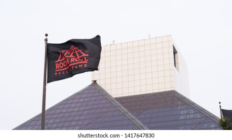 Cleveland, Ohio/USA - June 1, 2019: Rock And Roll Hall Of Fame Destination With Glass Building Architecture, Flag, And White Background.