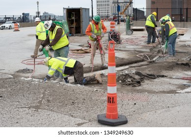 Cleveland, Ohio/USA -  March 15 2019: Large, Loud, And Diverse Construction Crew Work On The Corner Of W Huron Rd And Ontario St Across From The JACK Parking Garage And Tower City Station.