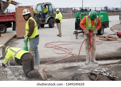 Cleveland, Ohio/USA -  March 15 2019: Large, Loud, And Diverse Construction Crew Work On The Corner Of W Huron Rd And Ontario St Across From The JACK Parking Garage And Tower City Station.