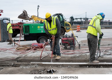 Cleveland, Ohio/USA -  March 15 2019: Large, Loud, And Diverse Construction Crew Work On The Corner Of W Huron Rd And Ontario St Across From The JACK Parking Garage And Tower City Station.