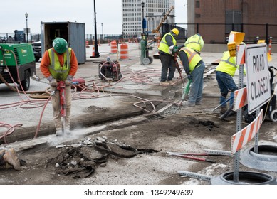 Cleveland, Ohio/USA -  March 15 2019: Large, Loud, And Diverse Construction Crew Work On The Corner Of W Huron Rd And Ontario St Across From The JACK Parking Garage And Tower City Station.