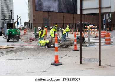 Cleveland, Ohio/USA -  March 15 2019: Construction Crew In Downtown Cleveland Tear Up The Pavement With Pneumatic Power Tools.