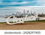 Cleveland Script sign at Edgewater park with city skyline in the background. Travel concept