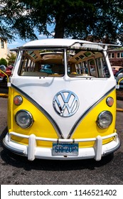 CLEVELAND, TENNESSEE, USA - JULY 28, 2018: A timeless classic, the VW Bus here in white and yellow on display at the MainStreet Cruise-In.