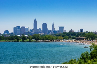 Cleveland, USA - June 30, 2019:  Hundreds of fun seekers visit Edgewater Beach on the shore of Lake Erie at Cleveland, Ohio with summer now in full vigor.