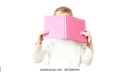 Clever Little Girl Hiding Behind The Notepad. Kid Is Playing Hide And Sick. Learning Concept. No Face Visible