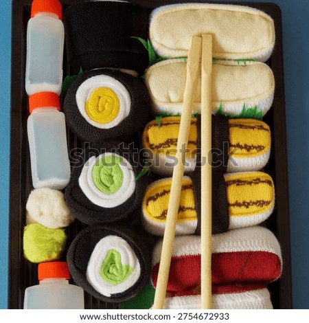 Cleverly folded socks creating a fun sushi set, perfect for a unique present