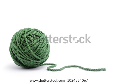 Clew of green thread for knitting isolated on white background