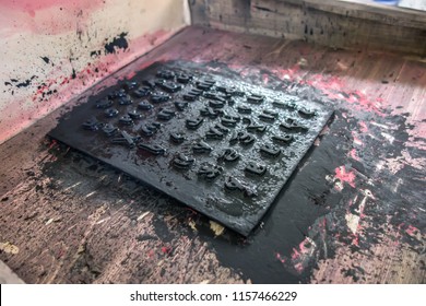 Cliche stamp with text inside an ancient wooden printing press close-up.  History of printing, printing technology. Old printing press letters. Cyrillic alphabet - Shutterstock ID 1157466229