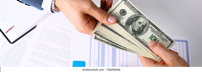 Client Arm Give Pack Of Hundred Dollars Bills To Manager As Insurance Payment Closeup. Driver Loss Prevention, Take Fee, Secure Road Trip Pay, Harmless Drive Idea, Owner Protective Offer Concept