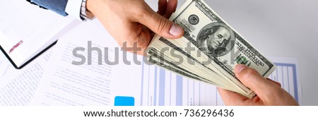 Client arm give pack of hundred dollars bills to manager as insurance payment closeup. Driver loss prevention, take fee, secure road trip pay, harmless drive idea, owner protective offer concept