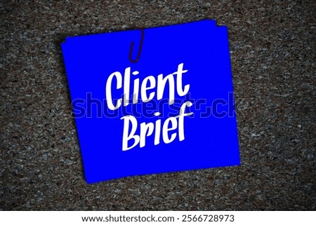 Client Brief text message on stick note on cork paper background