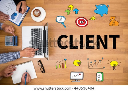 CLIENT Business team hands at work with financial reports and a laptop