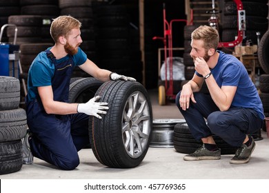 Client Buying Tires From Mechanic At Service.