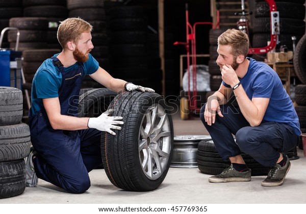 Client buying\
tires from mechanic at\
service.