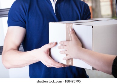 Client and courier during order transfer, horizontal - Powered by Shutterstock