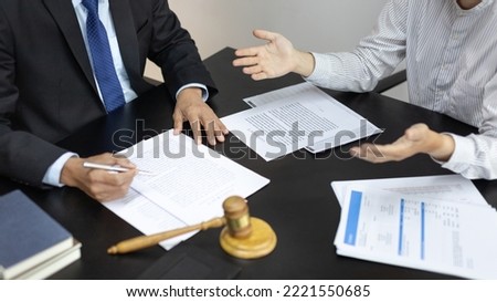 Client describes the money fraud problem and discusses the solution with a lawyer in the litigation room, Ethics in the courts include justice, legal consultant, Scales of justice, Litigation.