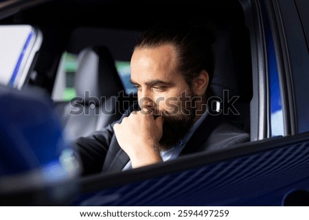 Client doing thorough car test drive, making sure he feels comfortable and enjoys driving vehicle. Customer trying out new automobile before purchase, to see if it is right for his needs