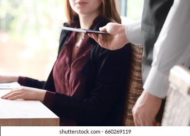 Client Getting Bill From Waiter At Restaurant, Close Up View