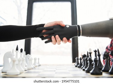 Client or patient doing handshake with bionic limb while sitting