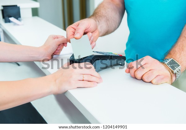 Client Reception Desk Making Contactless Payment Stock Image