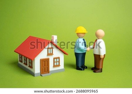 The client shakes hands with the builder after the completion of the property. Partnership, trust, and achievement. Real estate, construction business, customer relations, project management themes.