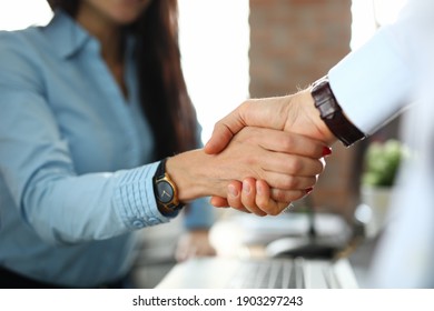 Client shaking hands with insurance agent in office closeup. Business cooperation concept - Shutterstock ID 1903297243