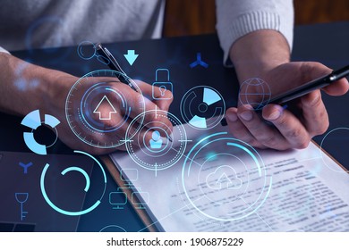 A client is signing the contract to create a software to present it at start up conference and gain investments for innovative service. Checking the details at smartphone. Hologram tech graphs.