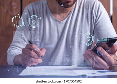 A client is signing the contract to create a software to present it at start up conference and gain investments for innovative service. Checking the details at smartphone. Hologram tech graphs.