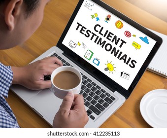 CLIENT TESTIMONIAIS Businessman at work. Close-up top view of man working on laptop while sitting at the wooden desk , coffee