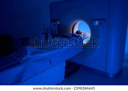 Client is undergoing computed tomography scanning of thorax