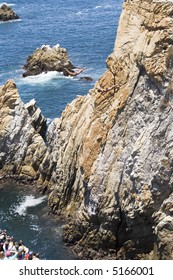 Cliff Diving In Acapulco, Mexico With Two Cliff Divers In The Air