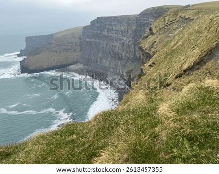 The cliff face and ocean at Cliffs of Moher in County Claire, Ireland