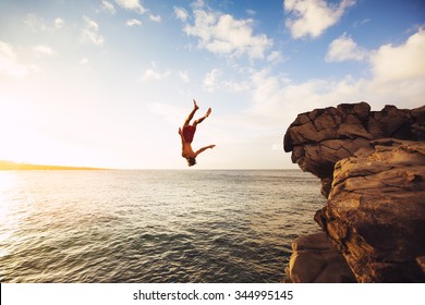 Cliff Jumping into the Ocean at Sunset, Outdoor Adventure Lifestyle