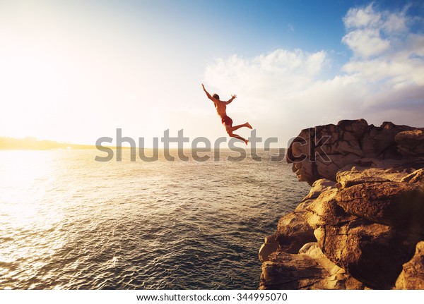 Cliff Jumping into the Ocean at Sunset, Summer\
Fun Lifestyle