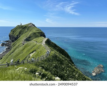 Cliff landscape at Cape Kamui at Hokkaido Japan in Sunny Weather and clear blue sea water - Powered by Shutterstock