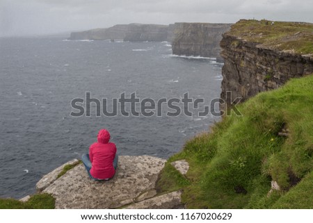 Similar – Ireland, Cliffs of Moher, woman, hiking