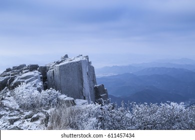 Cliff On The Edge Of A Mountain Covered In Snow And Ice In A Very Cold Day In Korea. 